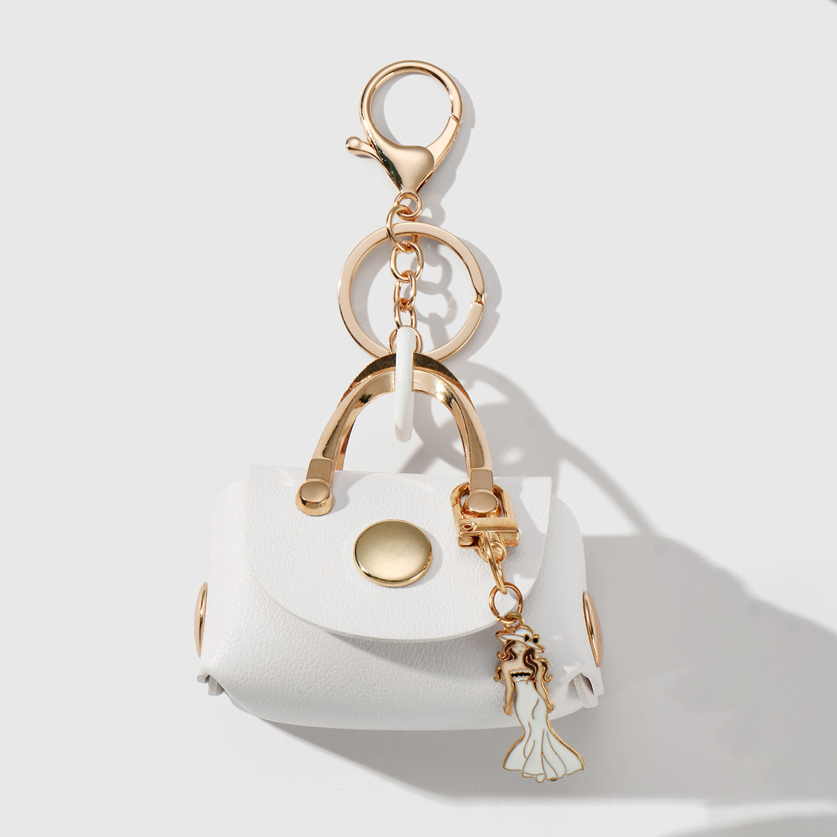 1 white small bag keychain 